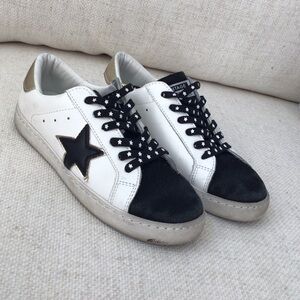 Vintage White Sneakers with Black Star and Gold Accents